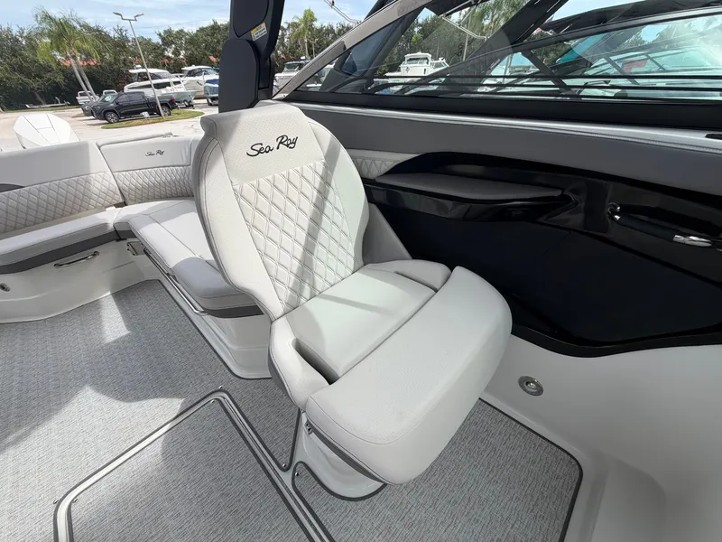 Slide: The Image of The interior of a 2027 Sea Ray SLX 280 Outboard with sleek, white upholstered seating. - 18