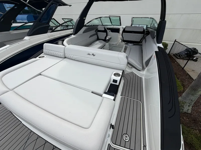 Slide: The Image of The image shows the spacious aft deck of a 2027 Sea Ray SLX 280 Outboard with sleek seating. - 10
