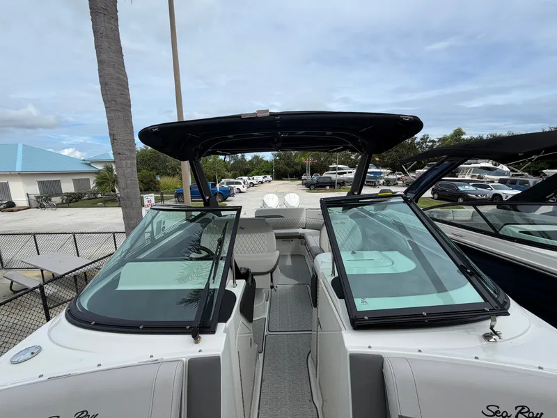 Slide: The Image of The image shows a Sea Ray SLX 280 Outboard boat with an open cockpit and modern seating. - 29