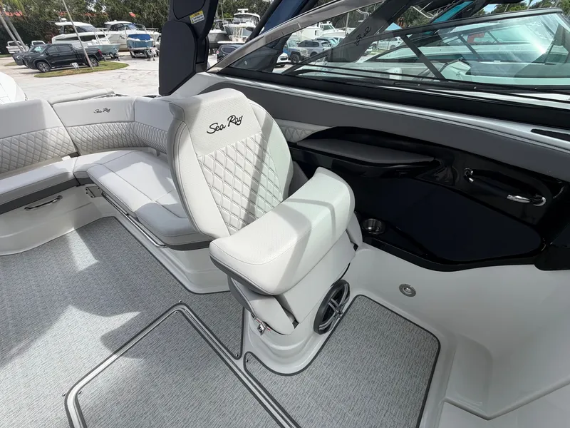 Slide: The Image of The image shows the interior of a Sea Ray SLX 280 Outboard with sleek white upholstery and modern details. - 17
