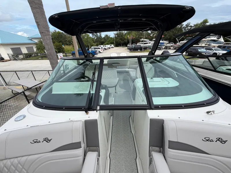 Slide: The Image of The image shows the cockpit of a 2027 Sea Ray SLX 280 Outboard with sleek seating. - 30