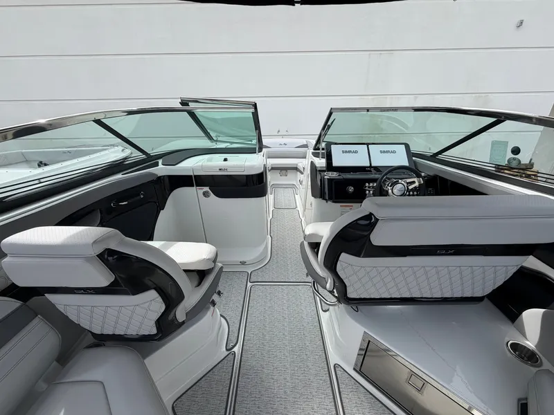 Slide: The Image of The image shows the cockpit of a 2027 Sea Ray SLX 280 Outboard with modern seating and controls. - 16