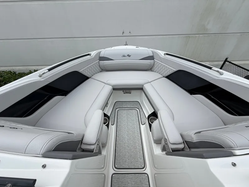 Slide: The Image of The image shows the bow of a Sea Ray SLX 280 Outboard with sleek white upholstery. - 26