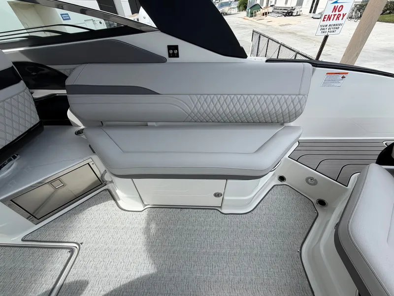 Slide: The Image of Interior of a Sea Ray SLX 280 Outboard with sleek, upholstered seating and modern design. - 14