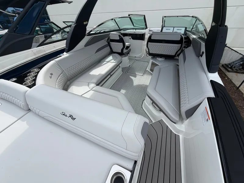 Slide: The Image of The image shows the interior of a 2027 Sea Ray SLX 280 Outboard with luxurious white seating. - 12