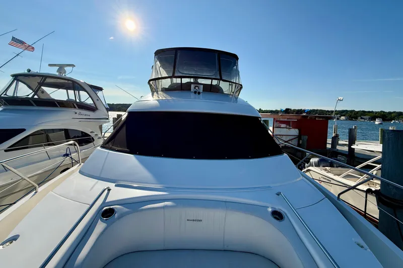 Slide: The Image of 2000 Silverton 453 Motor Yacht docked under clear blue sky. - 6