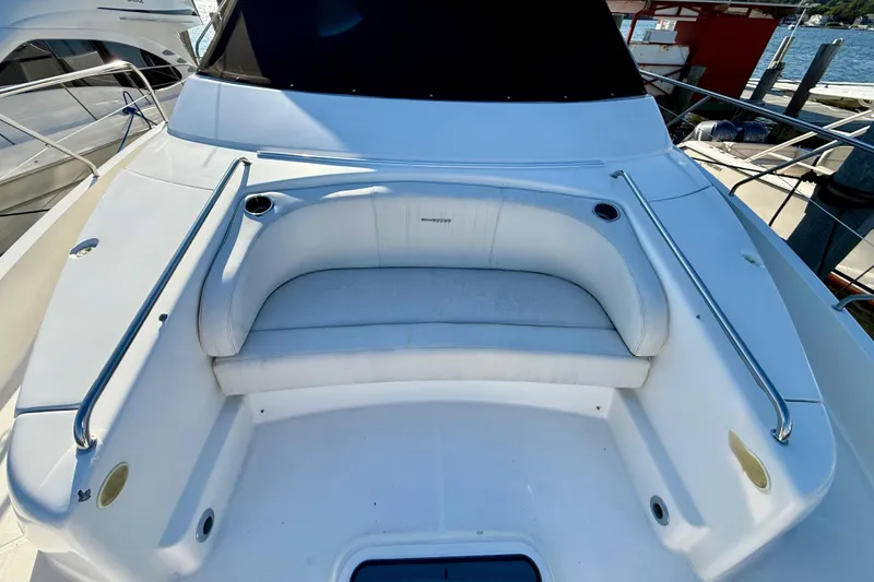 Slide: The Image of 2000 Silverton 453 Motor Yacht with spacious deck seating and stainless steel railings. - 7