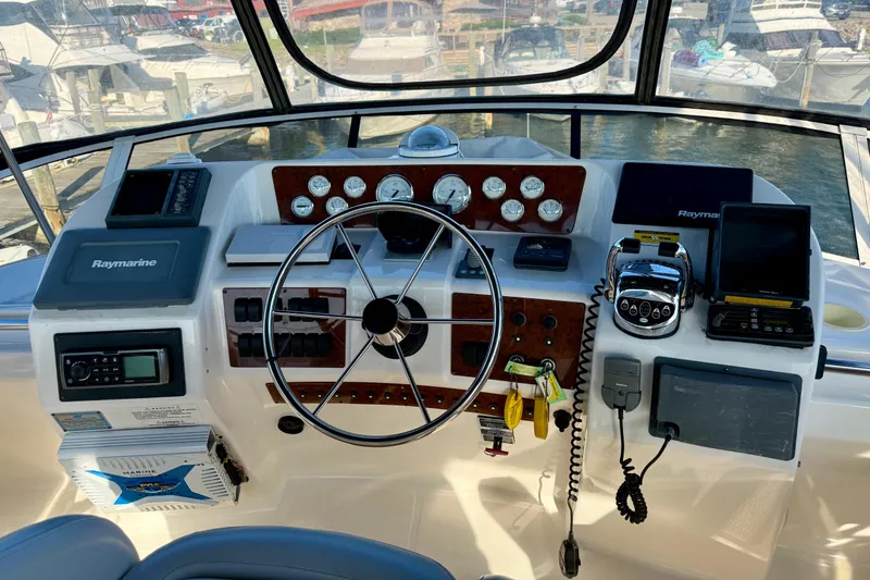 Slide: The Image of Cockpit of 2000 Silverton 453 Motor Yacht with navigation instruments and steering wheel. - 9