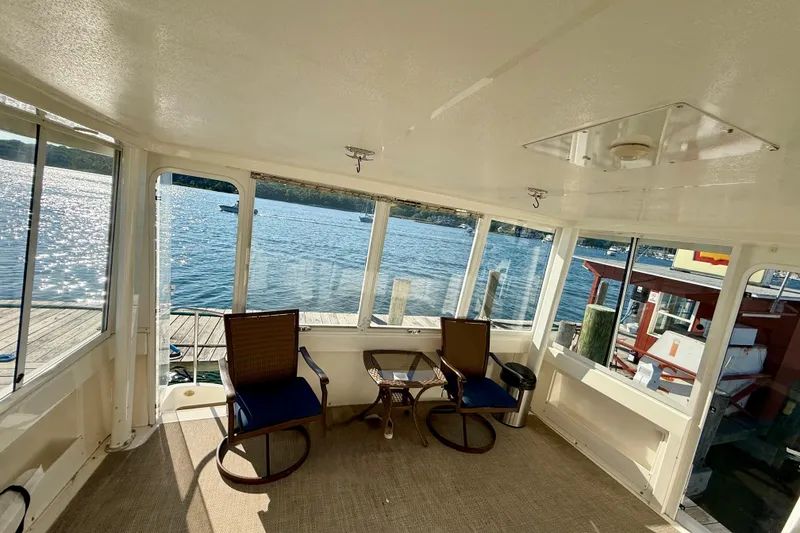 Slide: The Image of Interior view of a 2000 Silverton 453 Motor Yacht with waterfront scenery. - 4