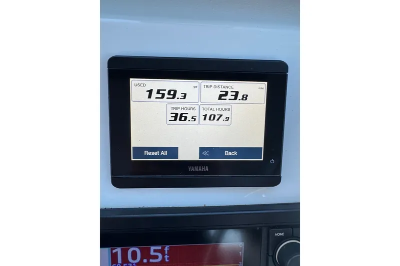Slide: The Image of Yamaha display on 2023 Parker 2320 SL Sport Cabin showing fuel usage and trip data. - 5