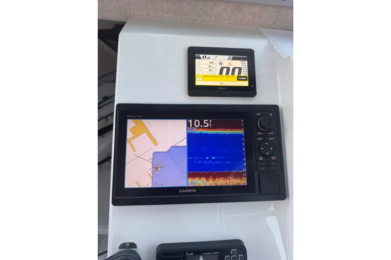 Slide: The Image of Garmin GPS and Yamaha display on 2023 Parker 2320 SL Sport Cabin boat dashboard. - 6