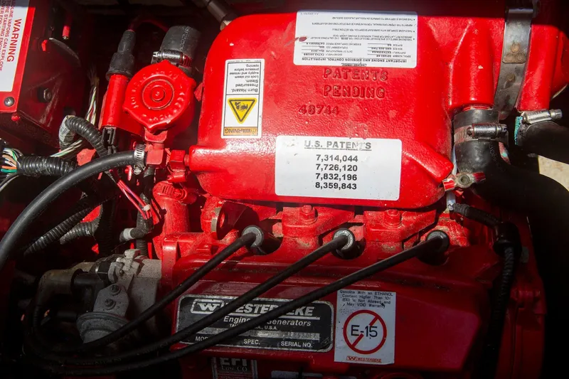 Slide: The Image of Engine compartment of a 1996 CRUISERS YACHTS 3580 Flybridge, featuring patent details. - 34