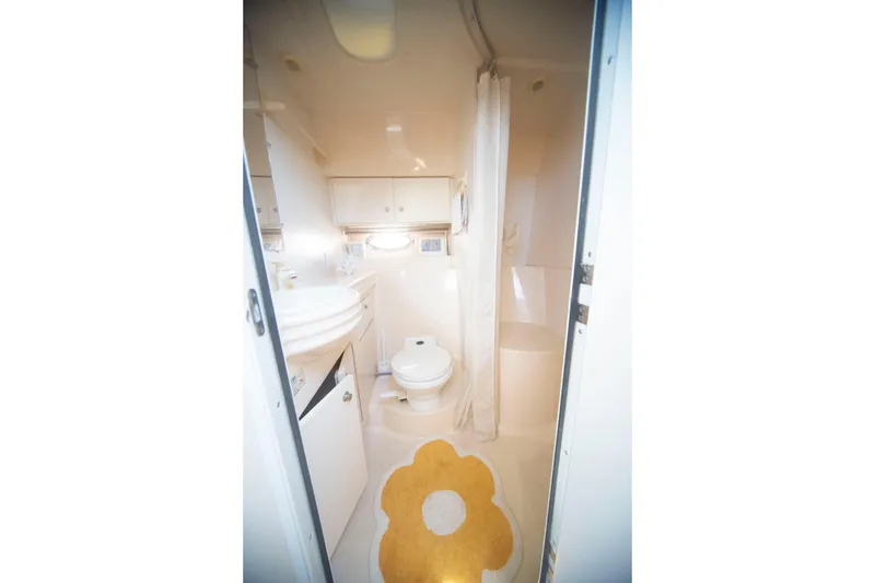 Slide: The Image of Bathroom interior of 1996 CRUISERS YACHTS 3580 Flybridge with floral rug. - 55