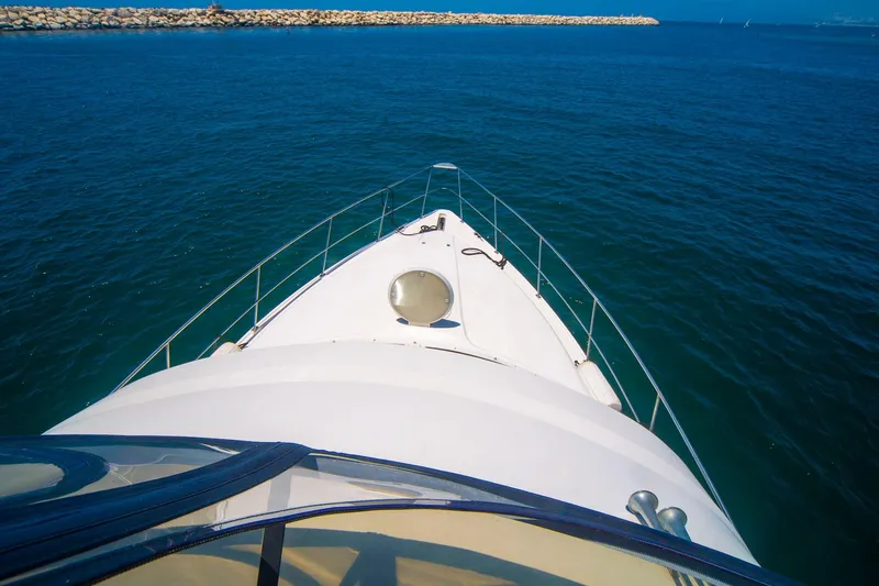 Slide: The Image of 1996 CRUISERS YACHTS 3580 Flybridge navigating open blue waters. - 31
