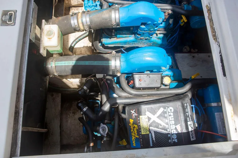 Slide: The Image of Engine compartment of a 1996 CRUISERS YACHTS 3580 Flybridge, featuring Crusader XL components. - 8