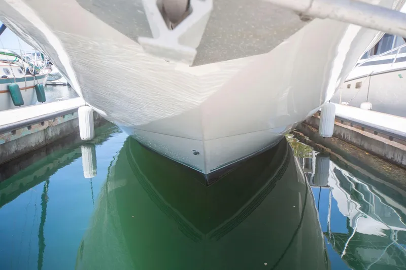 Slide: The Image of 1996 CRUISERS YACHTS 3580 Flybridge docked, reflecting on calm marina water. - 20