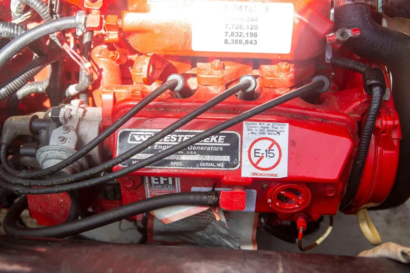 Slide: The Image of Engine compartment of a 1996 CRUISERS YACHTS 3580 Flybridge, featuring Westerbeke generator. - 33