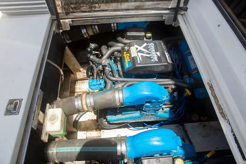 Slide: The Image of Engine compartment of 1996 CRUISERS YACHTS 3580 Flybridge, featuring Crusader XL engine. - 9