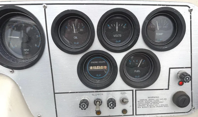 Slide: The Image of Dashboard of a 1983 Silverton 402 Motor Yacht with gauges and controls. - 11
