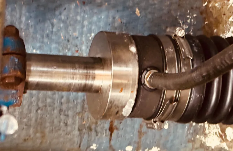 Slide: The Image of Propeller shaft of 1983 Silverton 402 Motor Yacht, showing metal and rubber components. - 31