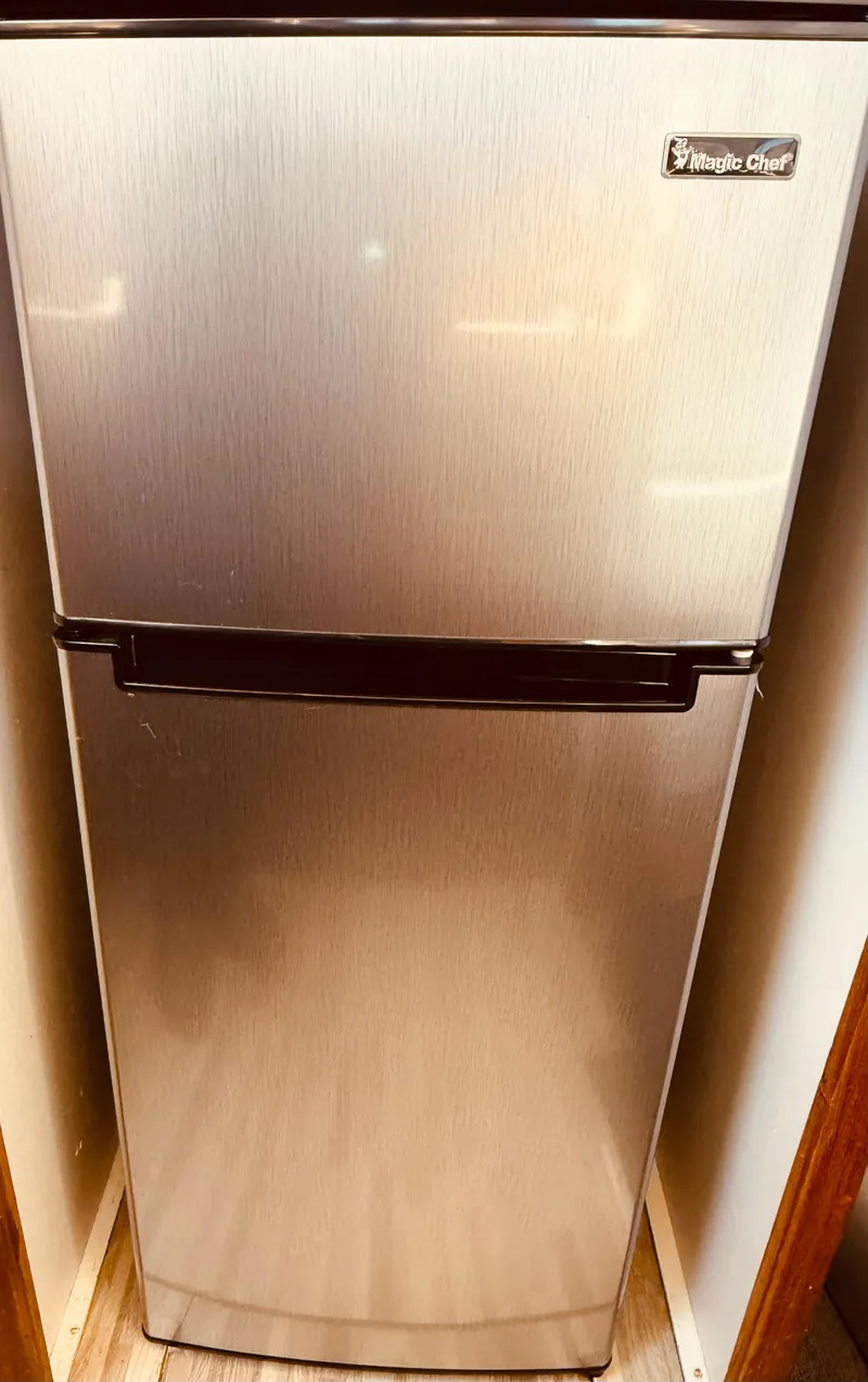 Slide: The Image of Stainless steel Whirlpool Chef refrigerator in a 1983 Silverton 402 Motor Yacht. - 19