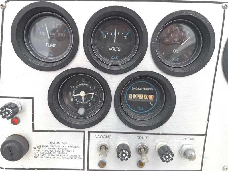 Slide: The Image of Instrument panel of a 1983 Silverton 402 Motor Yacht with gauges and switches. - 10