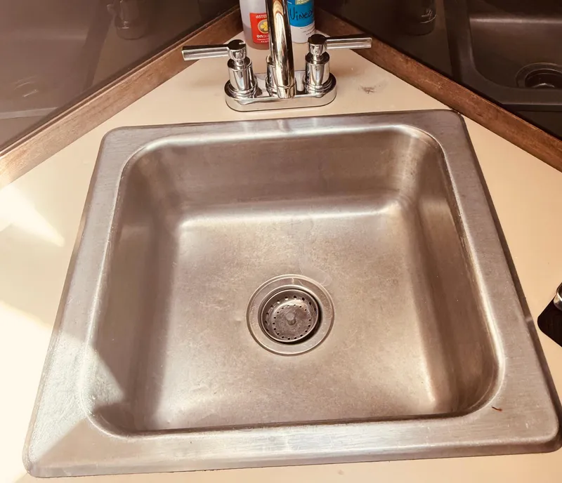 Slide: The Image of Stainless steel sink in 1983 Silverton 402 Motor Yacht kitchen area. - 17