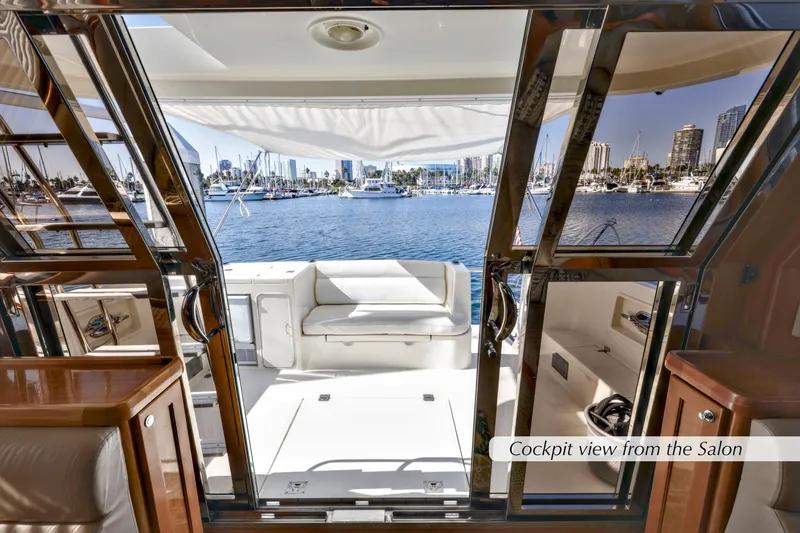 Slide: The Image of 2004 McKinna 57 Pilothouse yacht cockpit view from salon, overlooking marina. - 10
