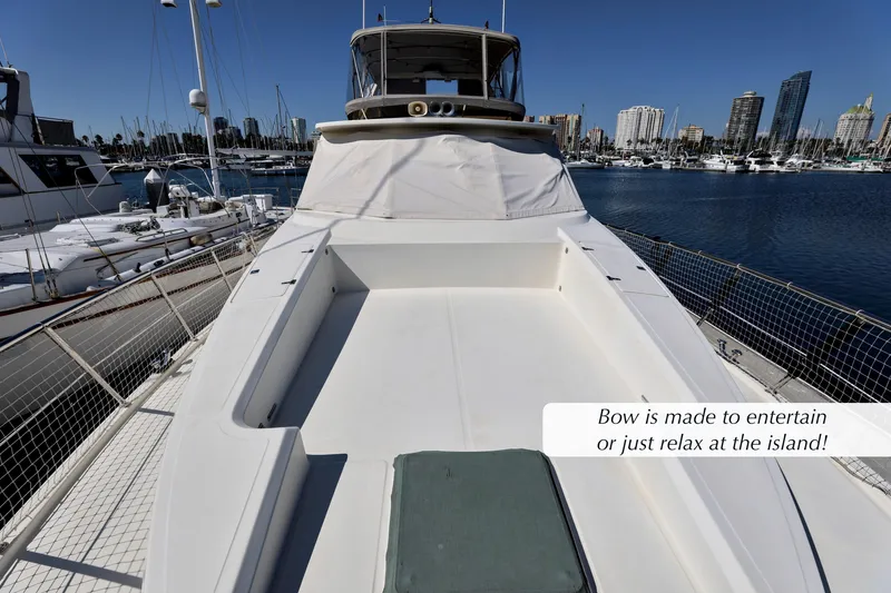 Slide: The Image of 2004 McKinna 57 Pilothouse yacht with spacious bow for entertainment, docked in marina. - 3