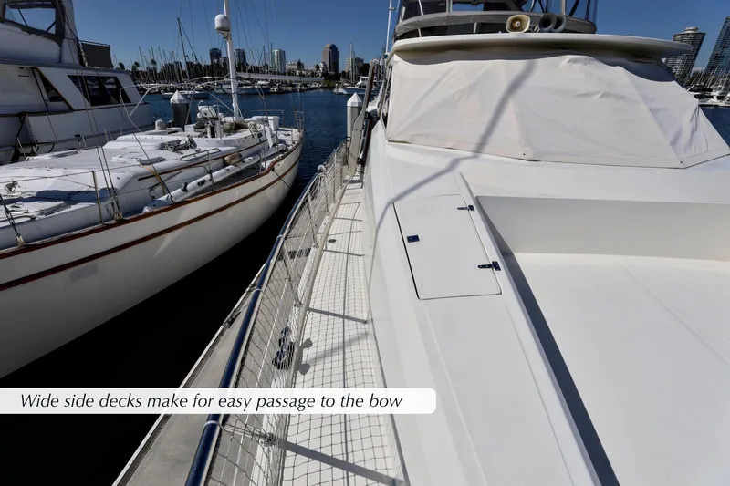Slide: The Image of 2004 McKinna 57 Pilothouse yacht with wide side decks in marina. - 4