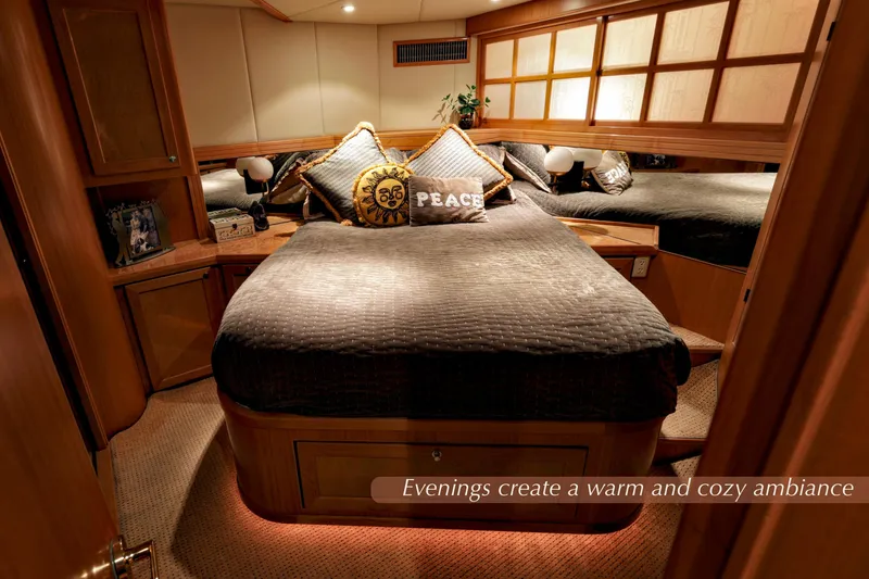 Slide: The Image of Luxurious 2004 McKinna 57 Pilothouse bedroom with warm lighting and cozy decor. - 33