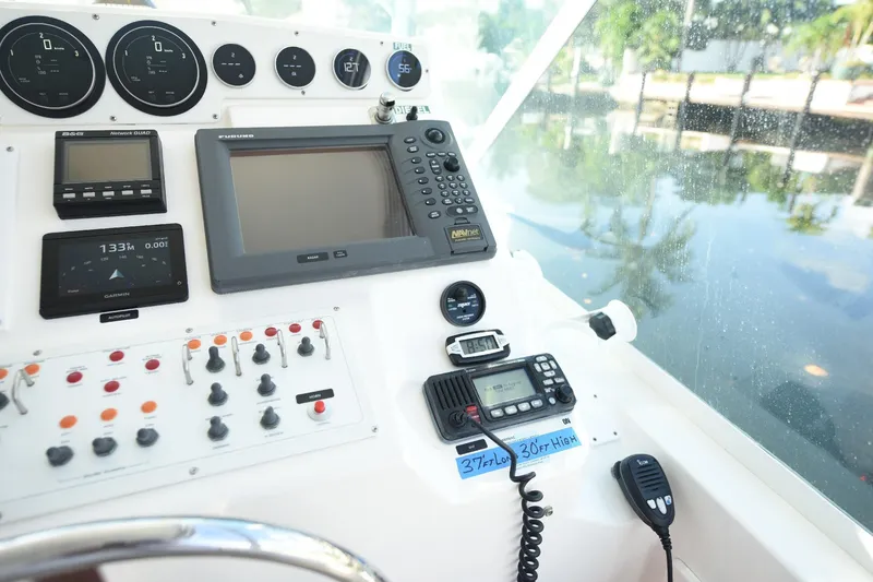 Slide: The Image of Control panel of a 2002 Cabo 35 Express boat with navigation instruments. - 55