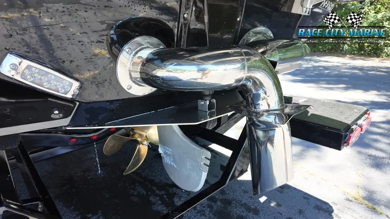Slide: The Image of Close-up of the exhaust and propeller of a 2027 Nautique G23, on a trailer. - 9
