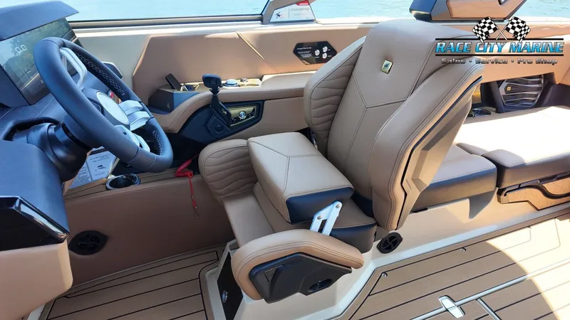 Slide: The Image of The image shows the interior of a 2027 Nautique G23 with luxurious beige seating. - 46