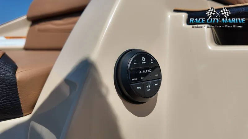 Slide: The Image of Close-up of a JL Audio control panel on a 2027 Nautique G23 boat. - 24