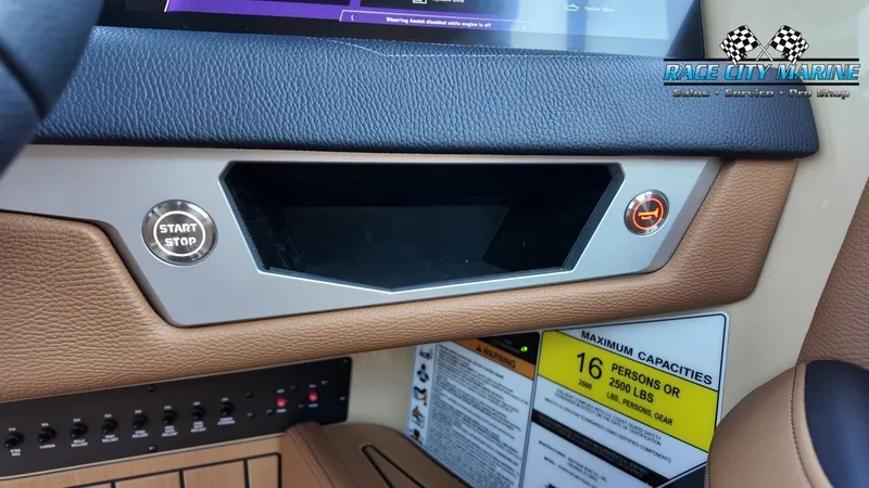Slide: The Image of The image shows the dashboard of a 2027 Nautique G23 with a start/stop button. - 20