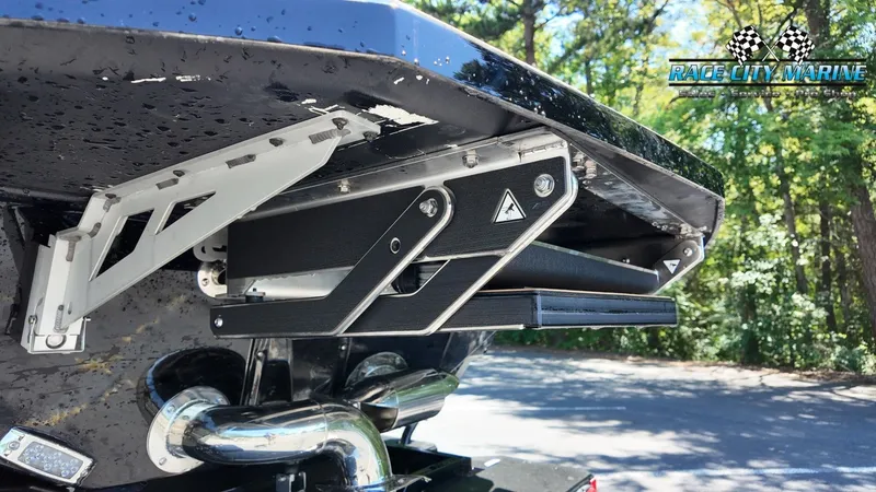Slide: The Image of Close-up of a Nautique G23 boat's stern showing exhaust and mechanical components. - 12