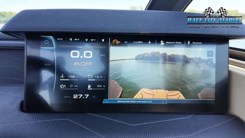Slide: The Image of The image shows the dashboard of a 2027 Nautique G23 with a digital display. - 36