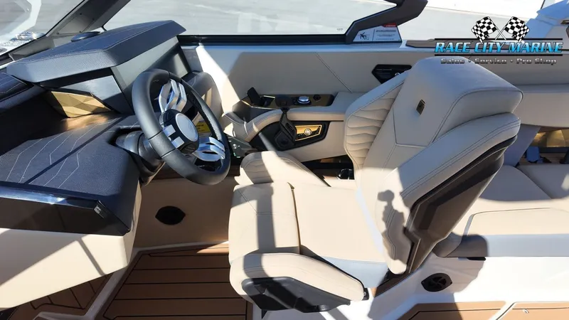Slide: The Image of The image shows the cockpit of a Nautique G25 boat with luxurious beige leather seats and a modern steering wheel. - 14