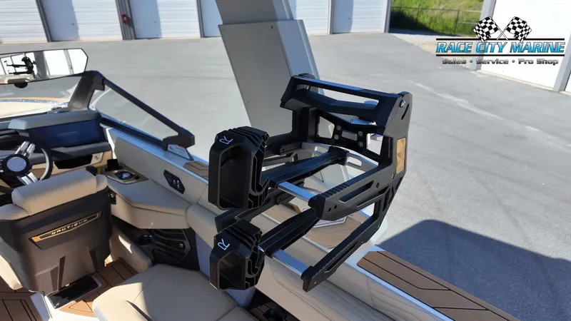 Slide: The Image of The image shows the interior of a Nautique G25 boat with a modern wakeboard rack. - 42