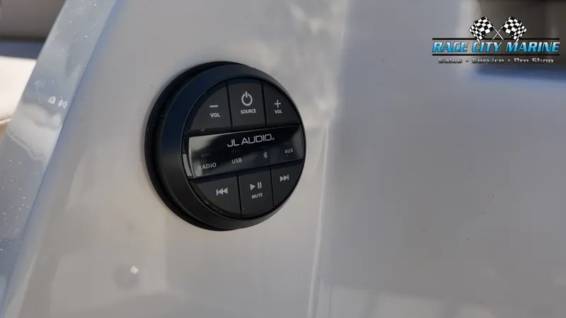 Slide: The Image of Close-up of a JL Audio control panel on a 2027 Nautique G25 boat. - 21