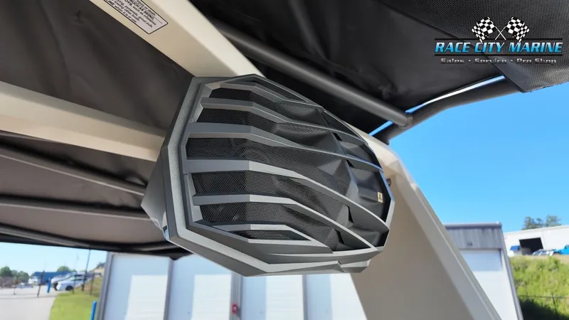 Slide: The Image of A speaker is mounted on the canopy of a Nautique G25 boat. - 49