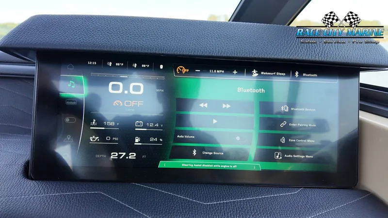 Slide: The Image of The image shows a modern dashboard of a Nautique G25 boat with a digital display. - 16