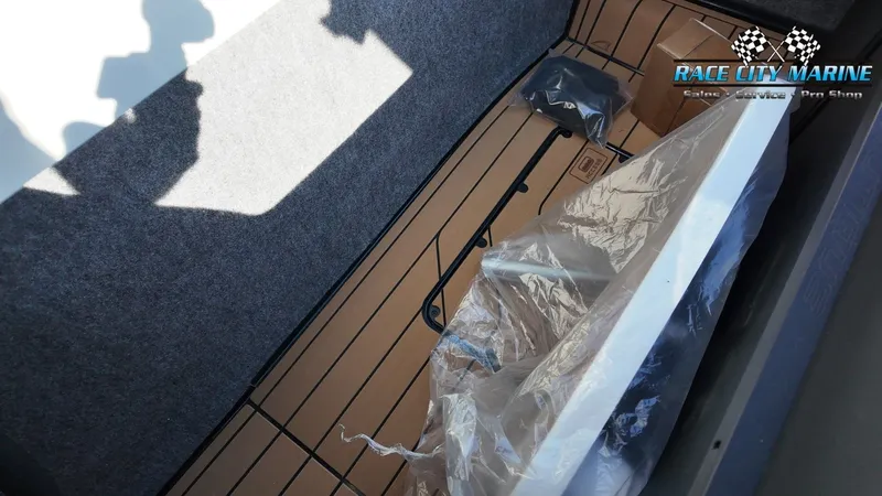 Slide: The Image of An interior of a boat with carpeted flooring and a packaged component. A logo is visible. - 48