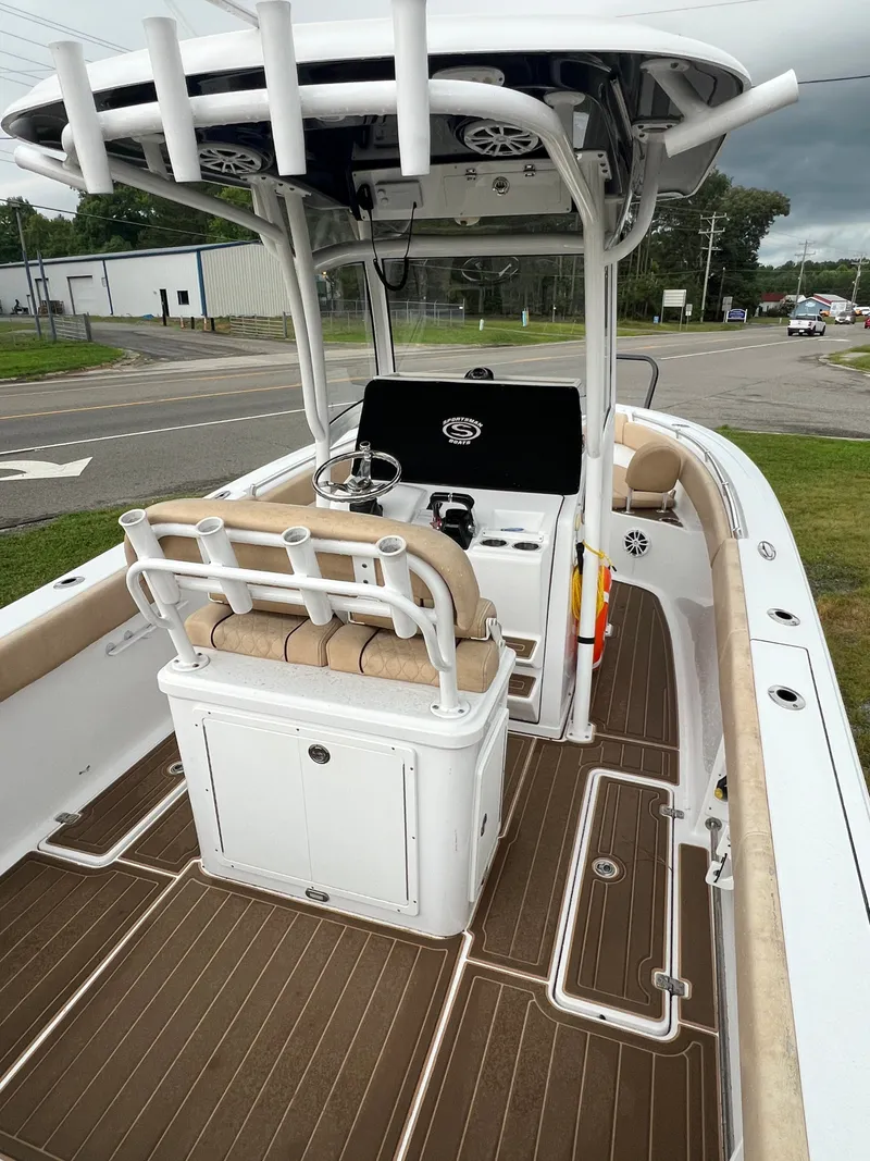 Slide: The Image of The image shows a 2018 Sportsman Open 252 Center Console boat with a modern helm station. - 5