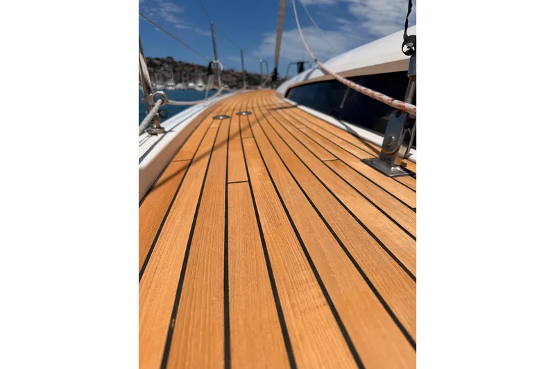 Slide: The Image of Teak deck of 2020 Beneteau Oceanis 51.1 yacht under clear blue sky. - 10
