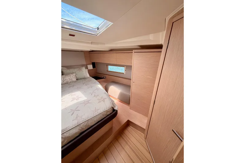 Slide: The Image of Luxurious cabin interior of 2020 Beneteau Oceanis 51.1 yacht with skylight and wooden finishes. - 73