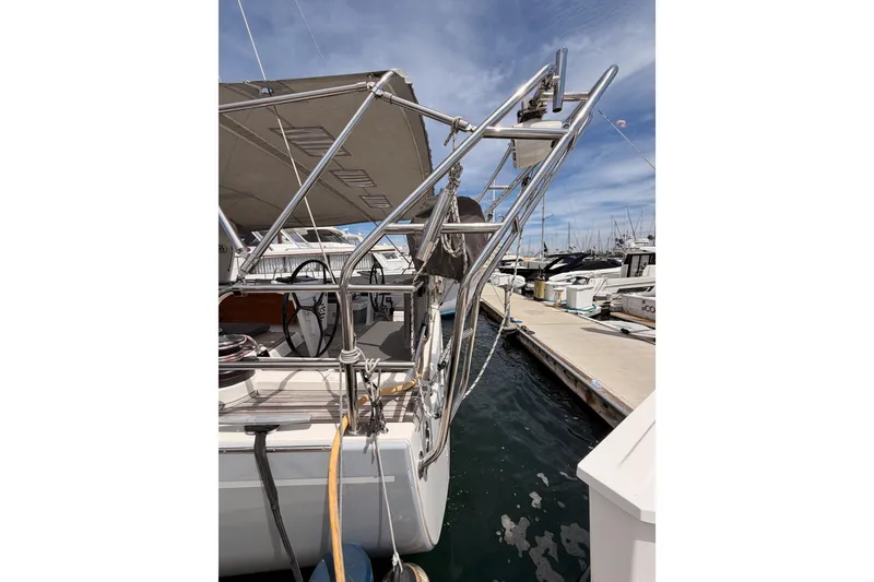 Slide: The Image of Beneteau Oceanis 51.1 yacht docked at marina, showcasing sleek design and modern features. - 6