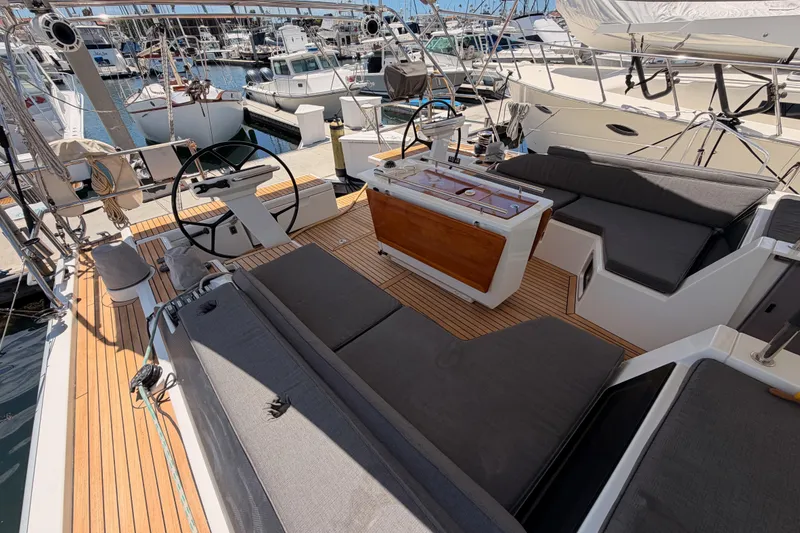 Slide: The Image of Spacious deck of 2020 Beneteau Oceanis 51.1 yacht with comfortable seating and dual steering wheels. - 24