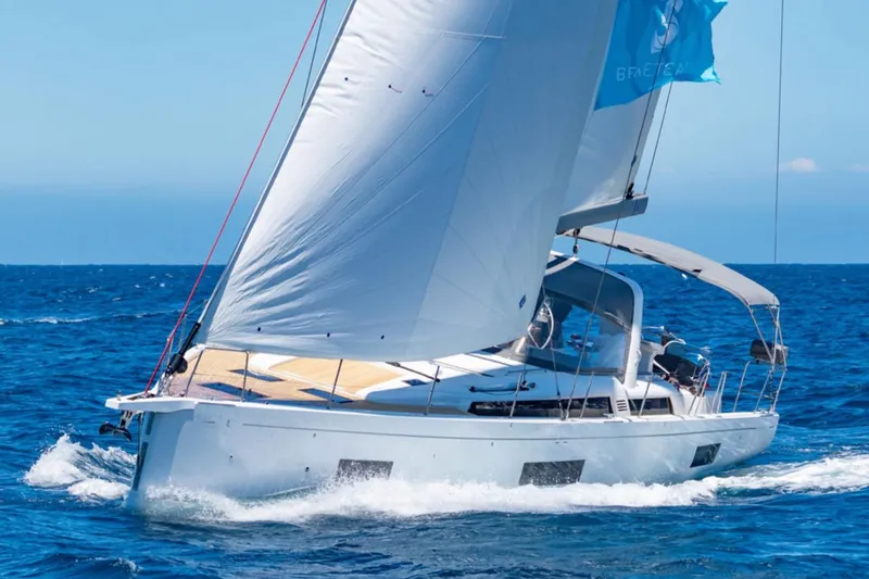 The Image of 2020 Beneteau Oceanis 51.1 sailing yacht navigating open sea with full sails. - 0